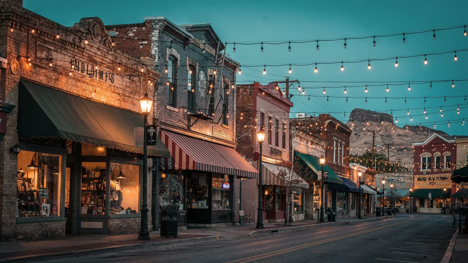 Historic Glendale downtown with brick storefronts, vintage awnings and string lights at dusk