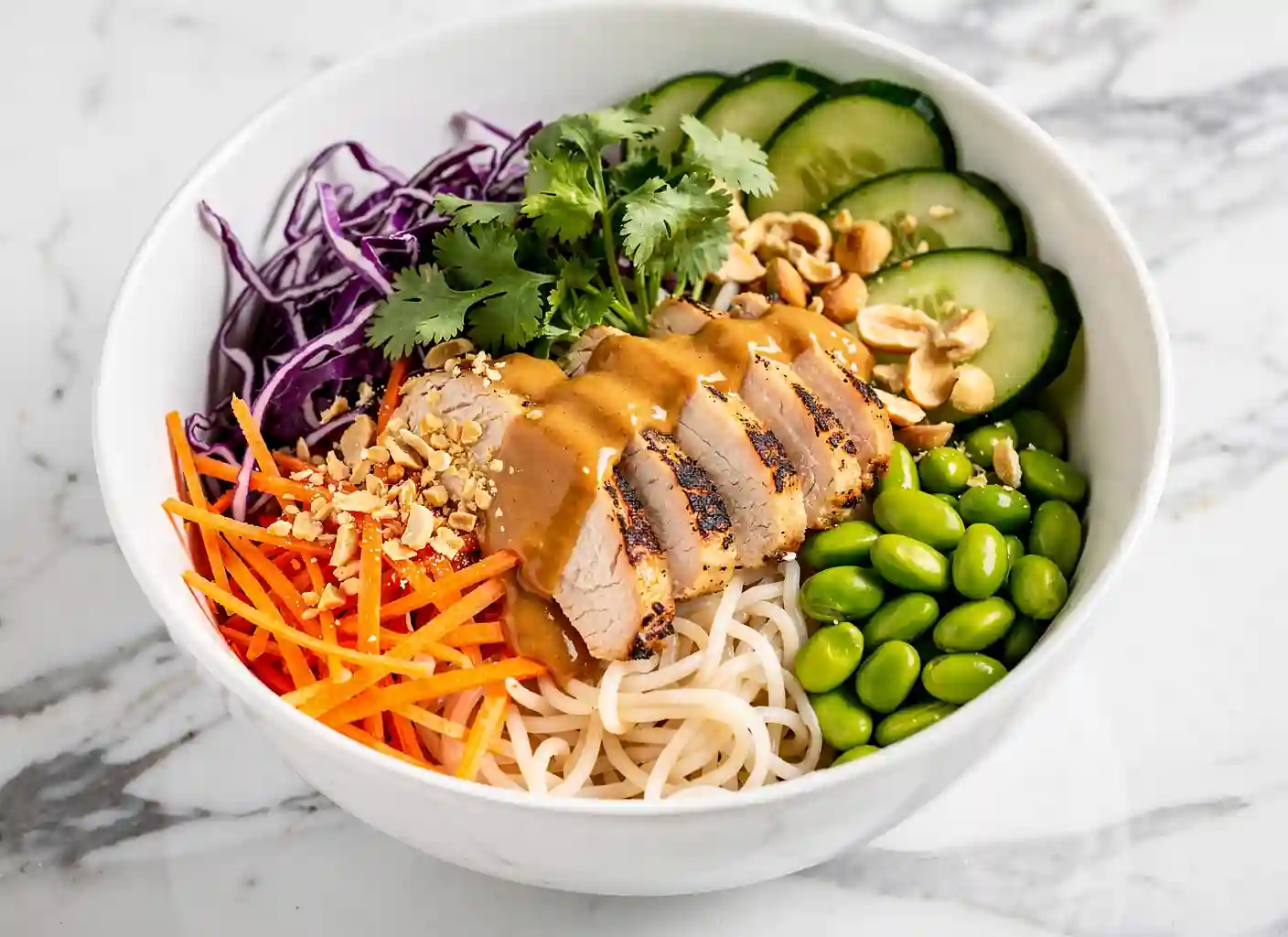 Thai peanut bowl with rice noodles and peanut sauce